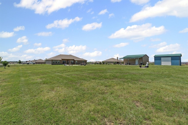 104 Knoll Ln, Decatur, TX 76234 - view of grassy yard featuring an outbuilding, a pole building, and a garage