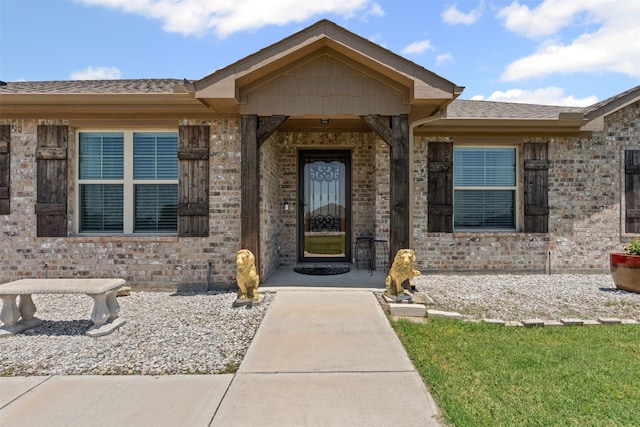 104 Knoll Ln, Decatur, TX 76234 - doorway to property with brick siding and a shingled roof