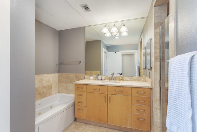 5055 Addison Cir Unit 413, Addison, TX 75001 - bathroom featuring vanity, a jetted tub, tile patterned flooring, and a shower stall