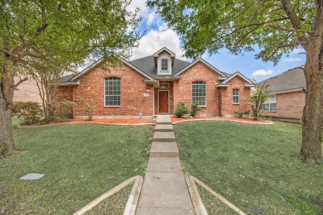 1330 Mercury Ln, Lancaster, TX 75134 - traditional-style home with brick siding, a front lawn, and roof with shingles