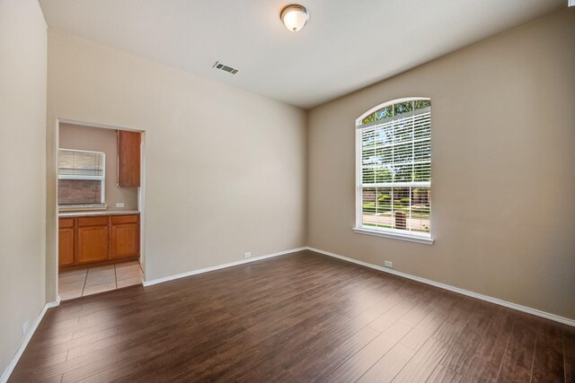 1330 Mercury Ln, Lancaster, TX 75134 - unfurnished room with wood finished floors and baseboards