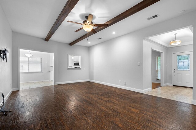 7422 Foxworth Dr, Dallas, TX 75248 - unfurnished living room with beamed ceiling, ceiling fan, wood finished floors, and recessed lighting