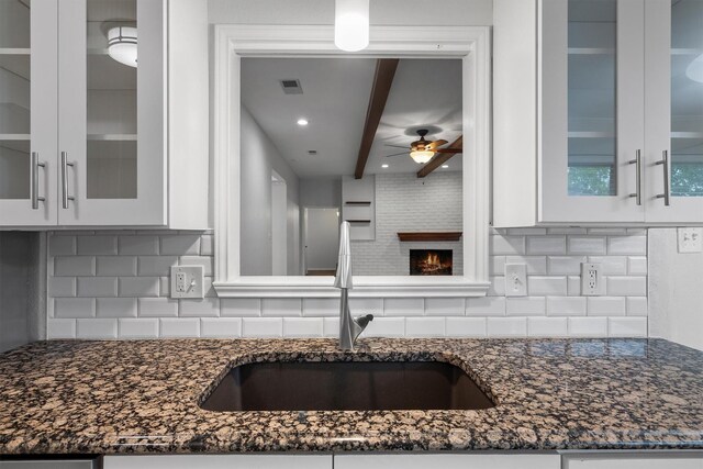7422 Foxworth Dr, Dallas, TX 75248 - kitchen with decorative backsplash, white cabinets, ceiling fan, dark stone countertops, and recessed lighting