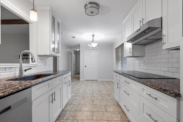 7422 Foxworth Dr, Dallas, TX 75248 - kitchen with dishwasher, under cabinet range hood, black electric stovetop, backsplash, and white cabinets