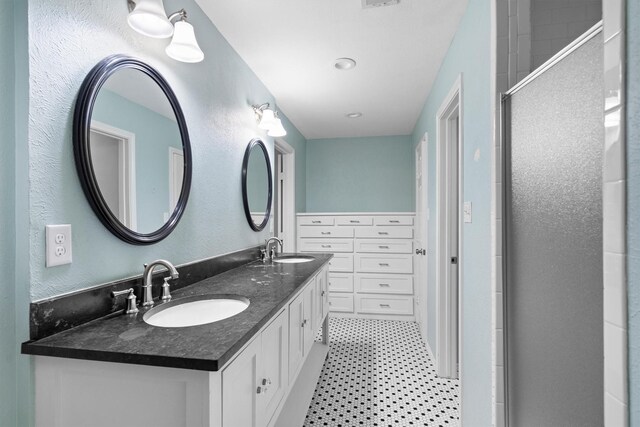 7422 Foxworth Dr, Dallas, TX 75248 - full bath with double vanity, a stall shower, and tile patterned floors