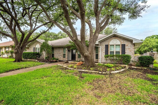 7422 Foxworth Dr, Dallas, TX 75248 - ranch-style house with brick siding, a front lawn, and roof with shingles