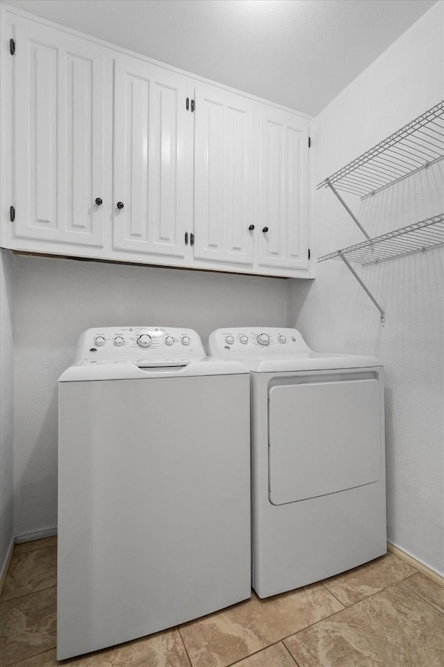 7422 Foxworth Dr, Dallas, TX 75248 - laundry area featuring separate washer and dryer and cabinet space