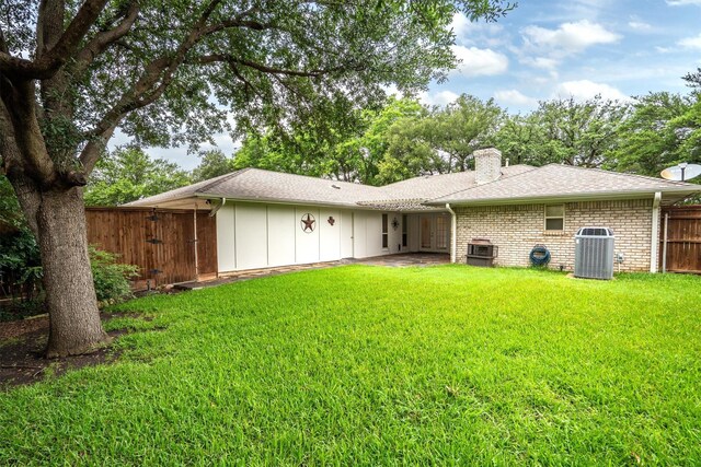 7422 Foxworth Dr, Dallas, TX 75248 - rear view of house with a chimney, brick siding, and a shingled roof