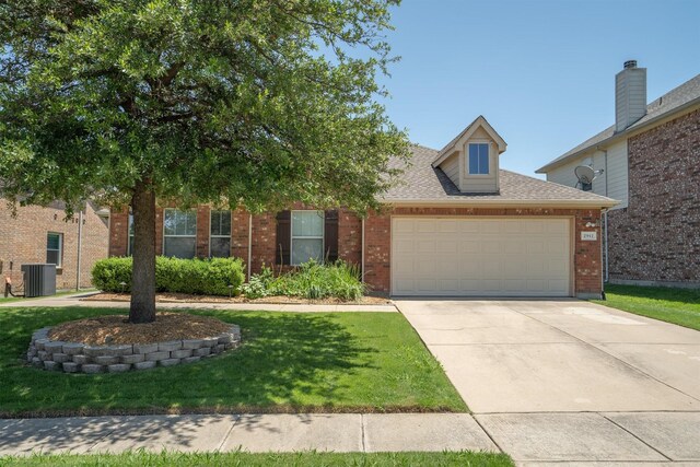 2912 Day Star Dr, Little Elm, TX 75068 - view of front of property featuring a garage, a front yard, concrete driveway, brick siding, and roof with shingles