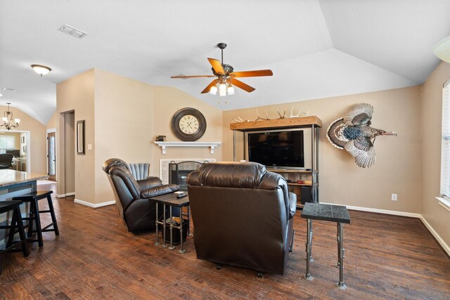 2912 Day Star Dr, Little Elm, TX 75068 - living area with vaulted ceiling, a ceiling fan, a chandelier, wood finished floors, and a tile fireplace