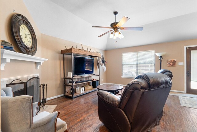 2912 Day Star Dr, Little Elm, TX 75068 - living room featuring a ceiling fan, wood finished floors, lofted ceiling, and a tile fireplace