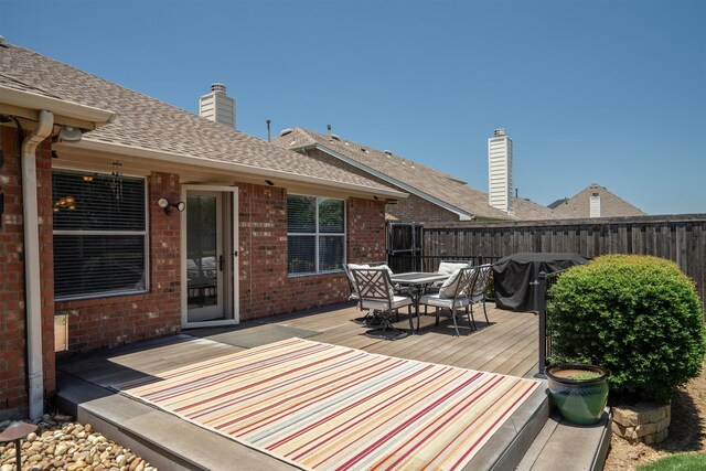 2912 Day Star Dr, Little Elm, TX 75068 - wooden deck with outdoor dining area and area for grilling