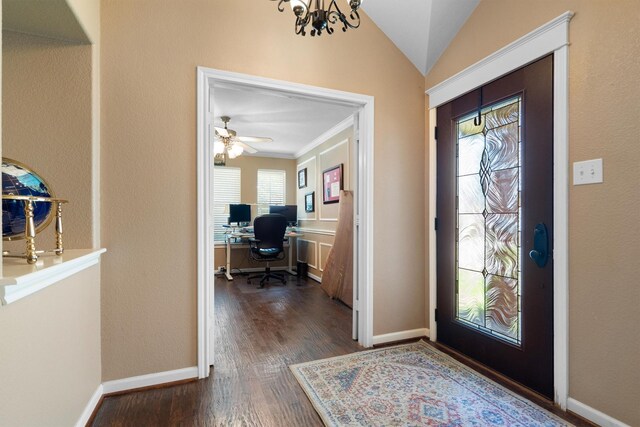 2912 Day Star Dr, Little Elm, TX 75068 - foyer with dark wood-style flooring, a chandelier, ornamental molding, lofted ceiling, and ceiling fan