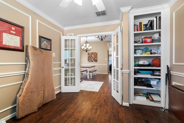 2912 Day Star Dr, Little Elm, TX 75068 - entrance foyer featuring french doors, dark wood-style floors, ornamental molding, and a chandelier