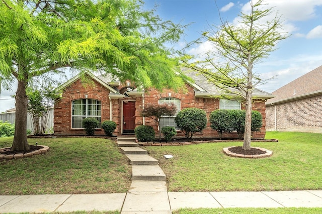 12313 Ark Rd, Frisco, TX 75035 - view of front of property with a front yard and brick siding