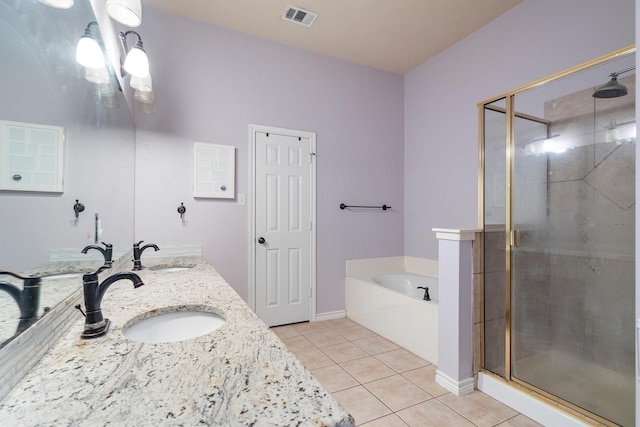 12313 Ark Rd, Frisco, TX 75035 - full bath with a stall shower, tile patterned floors, a garden tub, and double vanity