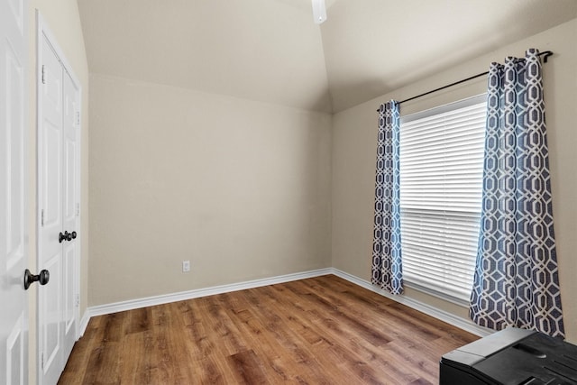 12313 Ark Rd, Frisco, TX 75035 - unfurnished bedroom featuring wood finished floors, lofted ceiling, and a closet