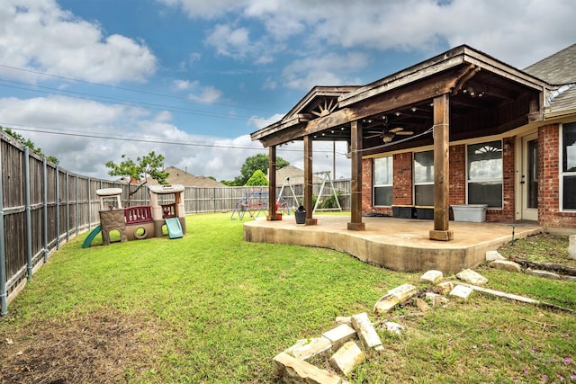 12313 Ark Rd, Frisco, TX 75035 - fenced backyard featuring a playground, a patio, and ceiling fan