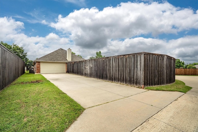 12313 Ark Rd, Frisco, TX 75035 - exterior space featuring driveway, brick siding, and a chimney