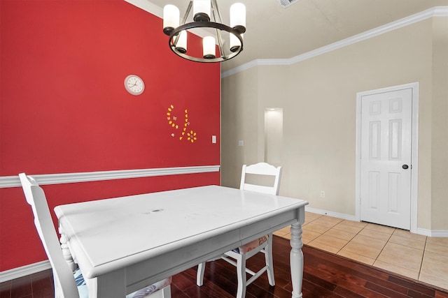 12313 Ark Rd, Frisco, TX 75035 - dining area featuring a chandelier, crown molding, and wood finished floors