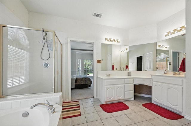 132 Sherwood Dr, Murphy, TX 75094 - ensuite bathroom with double vanity, a shower stall, a bath, and tile patterned flooring