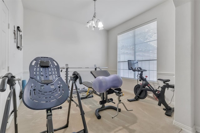 831 Fair Oaks Dr, Grand Prairie, TX 75052 - workout area with carpet and a chandelier