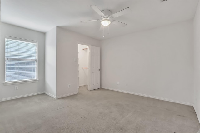 831 Fair Oaks Dr, Grand Prairie, TX 75052 - unfurnished bedroom featuring carpet flooring, a walk in closet, and a ceiling fan