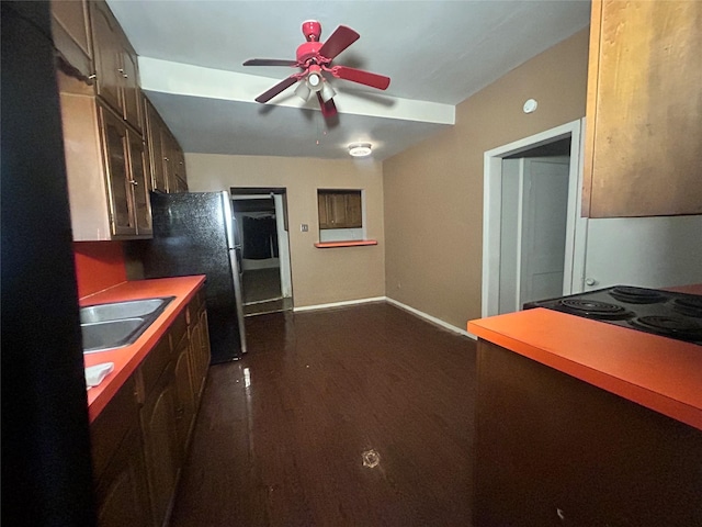 2806 Twyman, Dallas, TX 75215 - kitchen featuring freestanding refrigerator, ceiling fan, dark wood-style floors, dark brown cabinetry, and light countertops