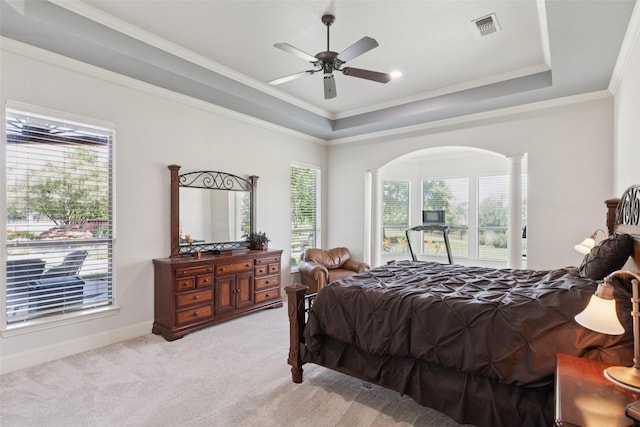 3030 Pecan Grove Ln, Celina, TX 75078 - bedroom featuring a raised ceiling, light colored carpet, arched walkways, ornamental molding, and a ceiling fan