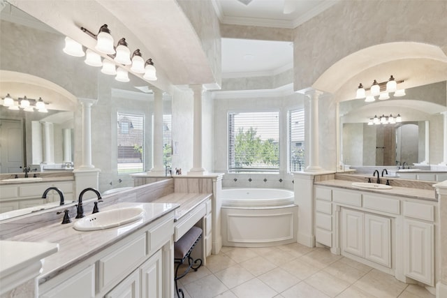 3030 Pecan Grove Ln, Celina, TX 75078 - bathroom featuring ornate columns, two vanities, a bath, tile patterned floors, and ornamental molding