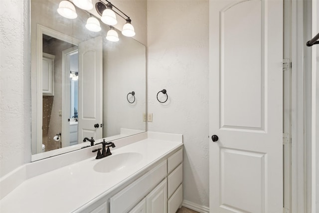 3030 Pecan Grove Ln, Celina, TX 75078 - bathroom featuring a textured wall and vanity