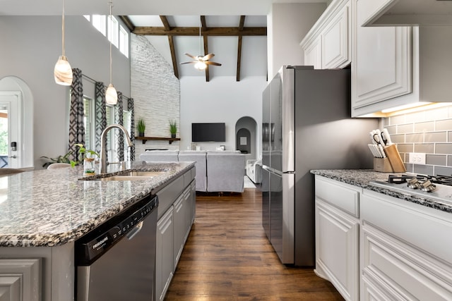 405 Milford, Wylie, TX 75098 - kitchen featuring stainless steel appliances, open floor plan, high vaulted ceiling, arched walkways, and dark wood-type flooring