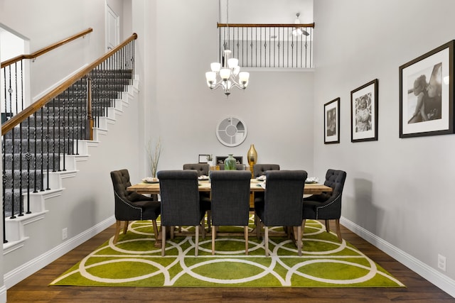 405 Milford, Wylie, TX 75098 - dining room featuring a towering ceiling, wood finished floors, a chandelier, and stairway