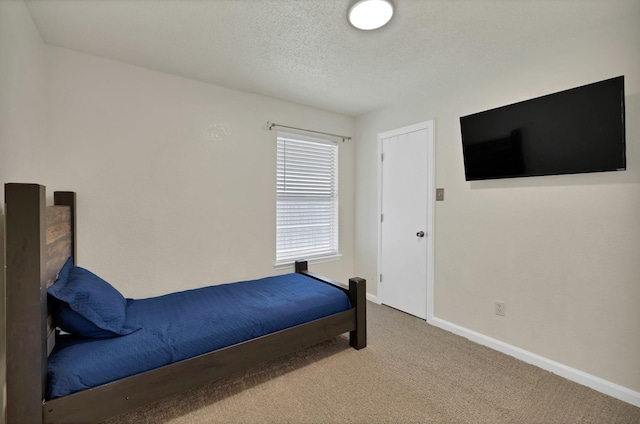 7104 Negril Ct, Fort Worth, TX 76137 - carpeted bedroom with baseboards and a textured ceiling