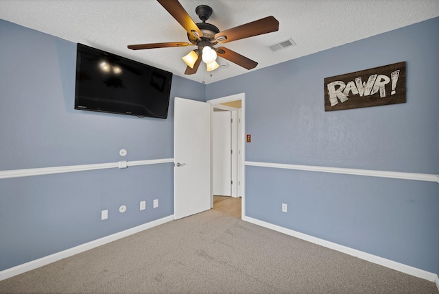 7104 Negril Ct, Fort Worth, TX 76137 - unfurnished bedroom featuring carpet floors, a ceiling fan, and a textured ceiling