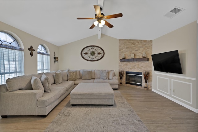 7104 Negril Ct, Fort Worth, TX 76137 - living room with light wood-style floors, ceiling fan, and a fireplace