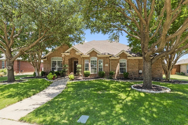 3718 Colonnade Grove Dr, Frisco, TX 75033 - view of front facade featuring brick siding, a front yard, and roof with shingles