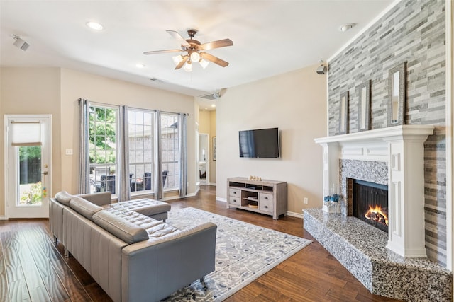 3718 Colonnade Grove Dr, Frisco, TX 75033 - living room featuring ceiling fan, a tiled fireplace, dark wood-type flooring, and recessed lighting