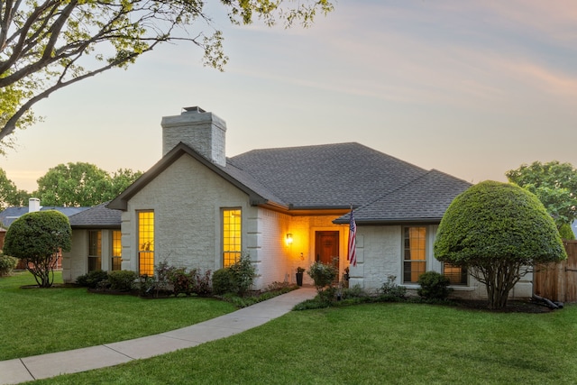 3505 Bentley Ct, Plano, TX 75093 - view of front of home featuring stone siding, a chimney, a front yard, and a shingled roof