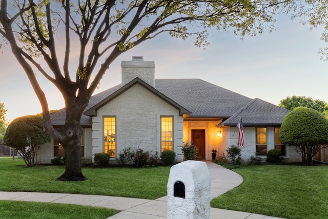3505 Bentley Ct, Plano, TX 75093 - view of front of property featuring roof with shingles, a lawn, a chimney, and stone siding