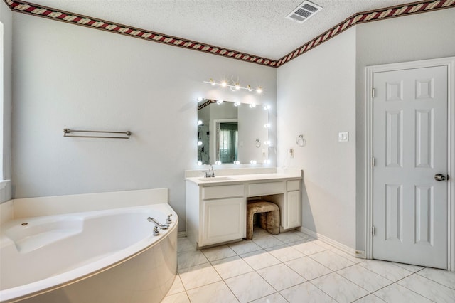 8224 Spring Valley Ln, Plano, TX 75025 - bathroom featuring vanity, a bath, tile patterned floors, and a textured ceiling
