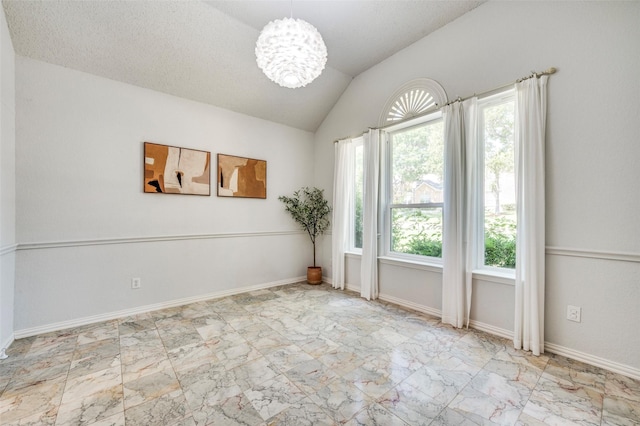 8224 Spring Valley Ln, Plano, TX 75025 - empty room with vaulted ceiling, a chandelier, and marble look tiles