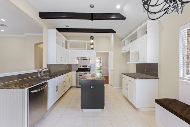 5853 Echo Bluff Dr, Haltom City, TX 76137 - kitchen featuring appliances with stainless steel finishes, under cabinet range hood, dark stone countertops, a center island, and white cabinetry