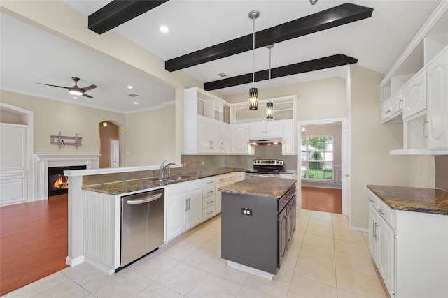 5853 Echo Bluff Dr, Haltom City, TX 76137 - kitchen featuring stainless steel appliances, white cabinets, ceiling fan, dark stone countertops, and a kitchen island