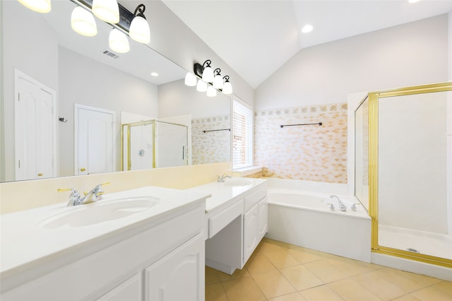 5853 Echo Bluff Dr, Haltom City, TX 76137 - bathroom featuring a stall shower, double vanity, a bath, tile patterned floors, and lofted ceiling