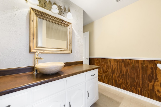 5853 Echo Bluff Dr, Haltom City, TX 76137 - bathroom with vanity, tile patterned floors, and a textured wall