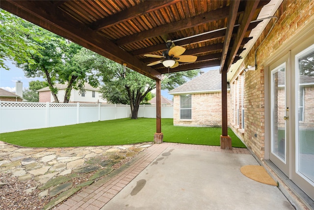 5853 Echo Bluff Dr, Haltom City, TX 76137 - fenced backyard with a ceiling fan and a patio