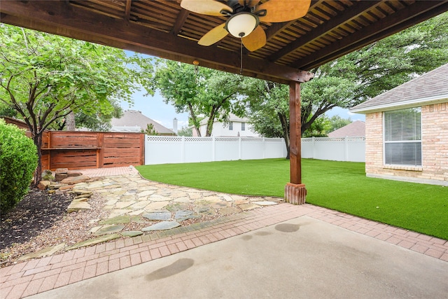 5853 Echo Bluff Dr, Haltom City, TX 76137 - fenced backyard with a patio area and a ceiling fan