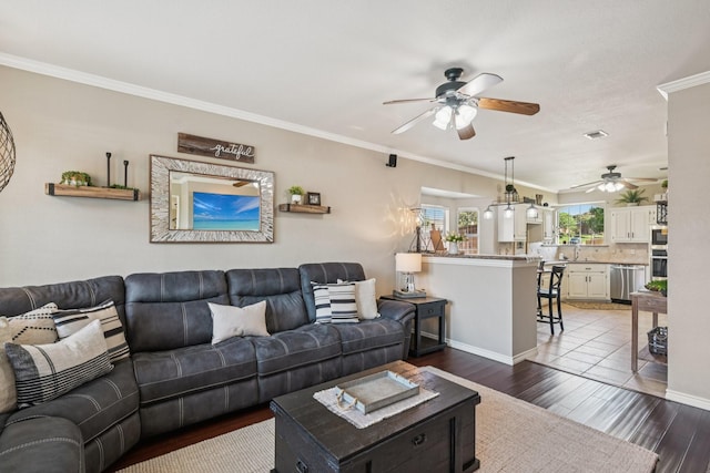 3707 Elizabeth Dr, Carrollton, TX 75007 - living area with a ceiling fan, wood finished floors, and crown molding