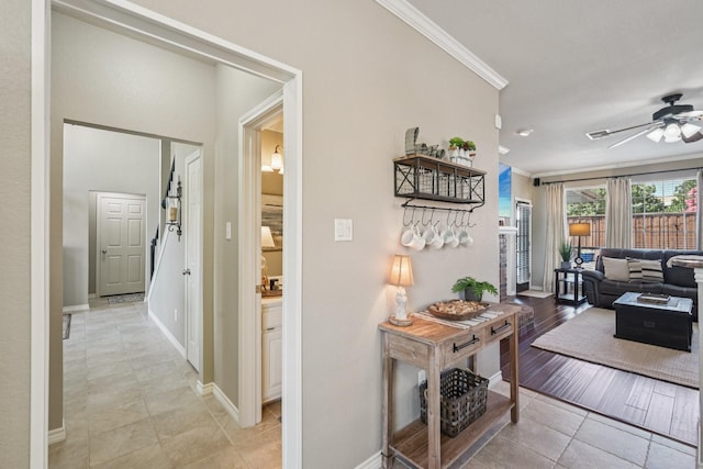 3707 Elizabeth Dr, Carrollton, TX 75007 - hall with ornamental molding and light tile patterned flooring